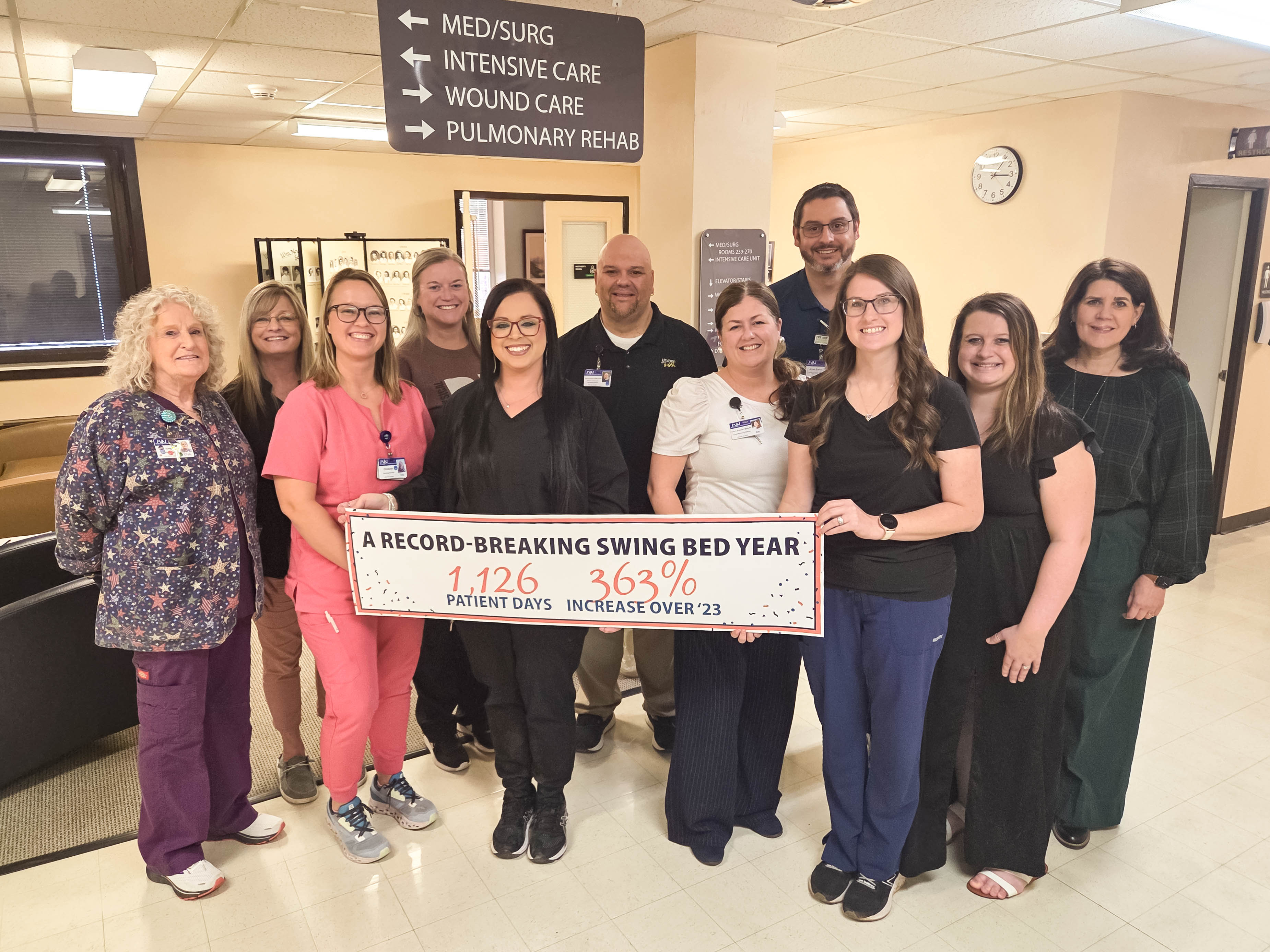 William Newton Hospital team members from nursing, case management, rehabilitation services, billing, dietary, pharmacy, and administration gather to celebrate a record-breaking year for the swing bed program.